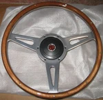 New 14" Laminated Riveted Wood Steering Wheel And Adaptor For Mga 1955-1962. Fixed Price $349.95.