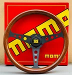 Universal Heritage Indy Black Woodgrain Mahogany Steering Wheel 350MM. Fixed Price $99.00.